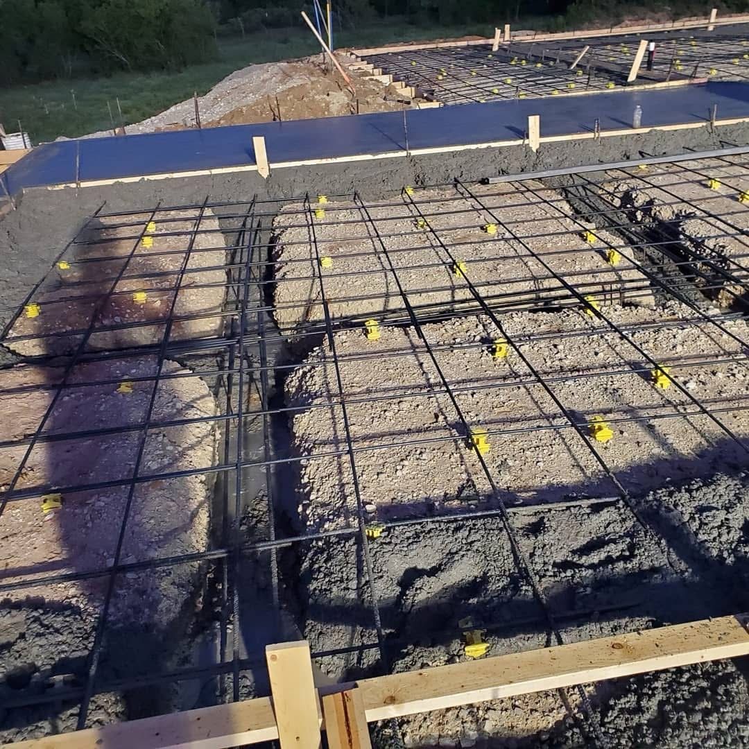 Steel rebar laid out over a foundation slab pour on a Visten Construction Group jobsite